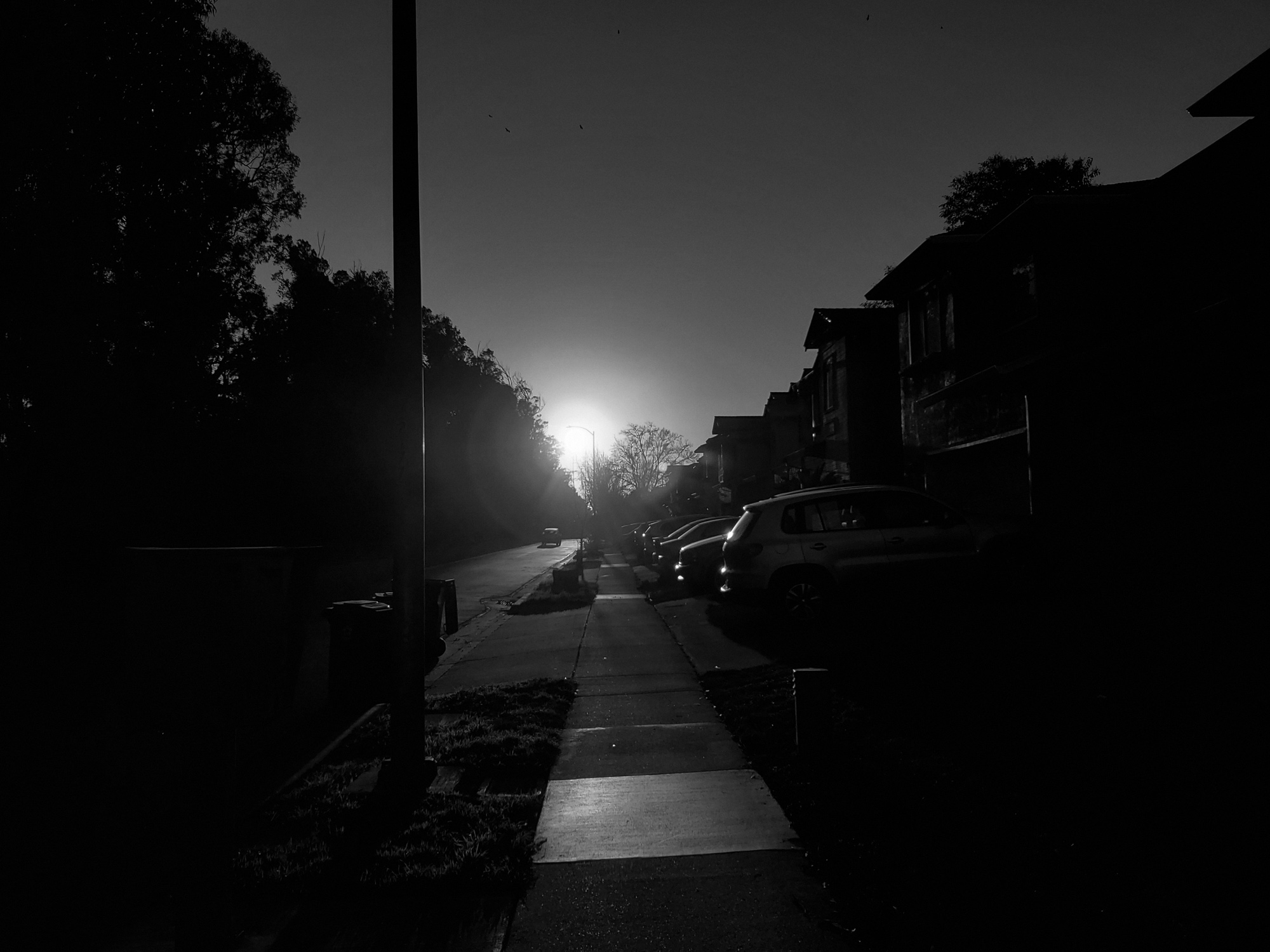 black and white picture of a sidewalk